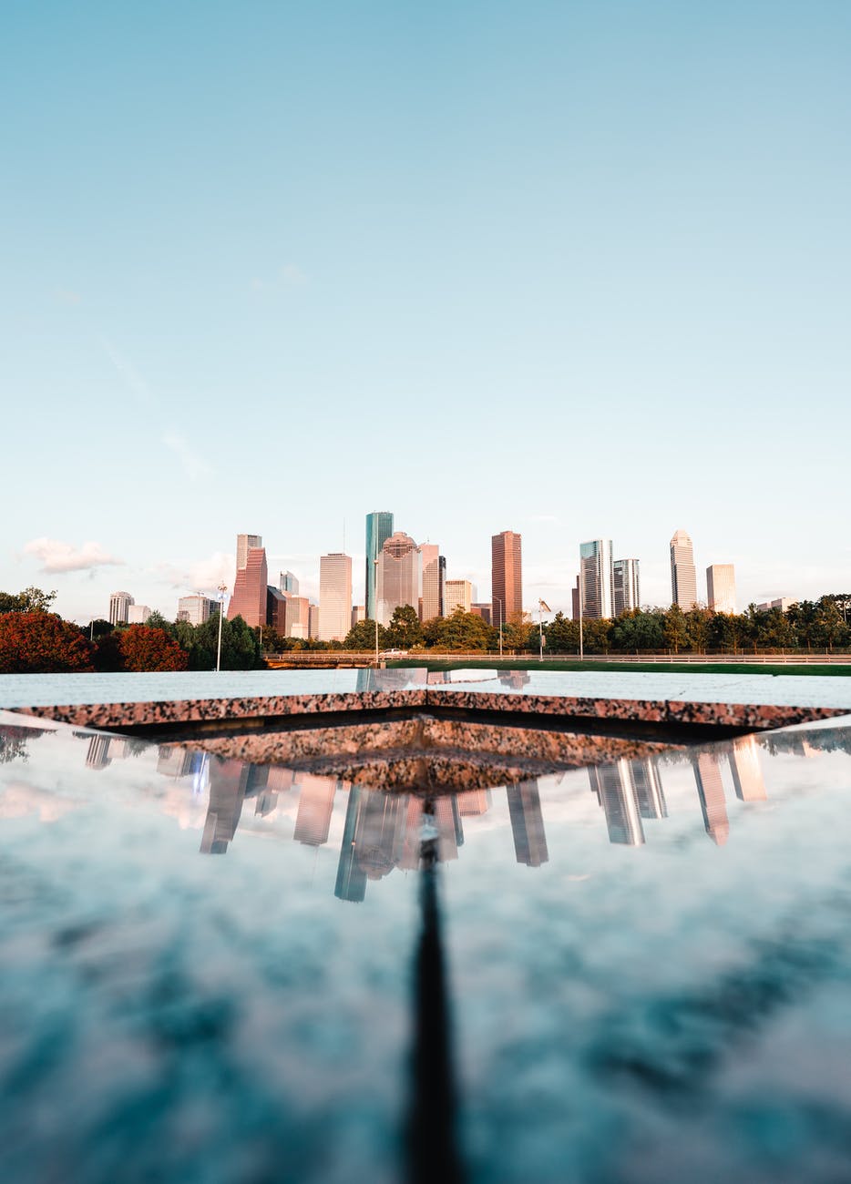 the reflection of the city skyline on the houston police officer s memorial